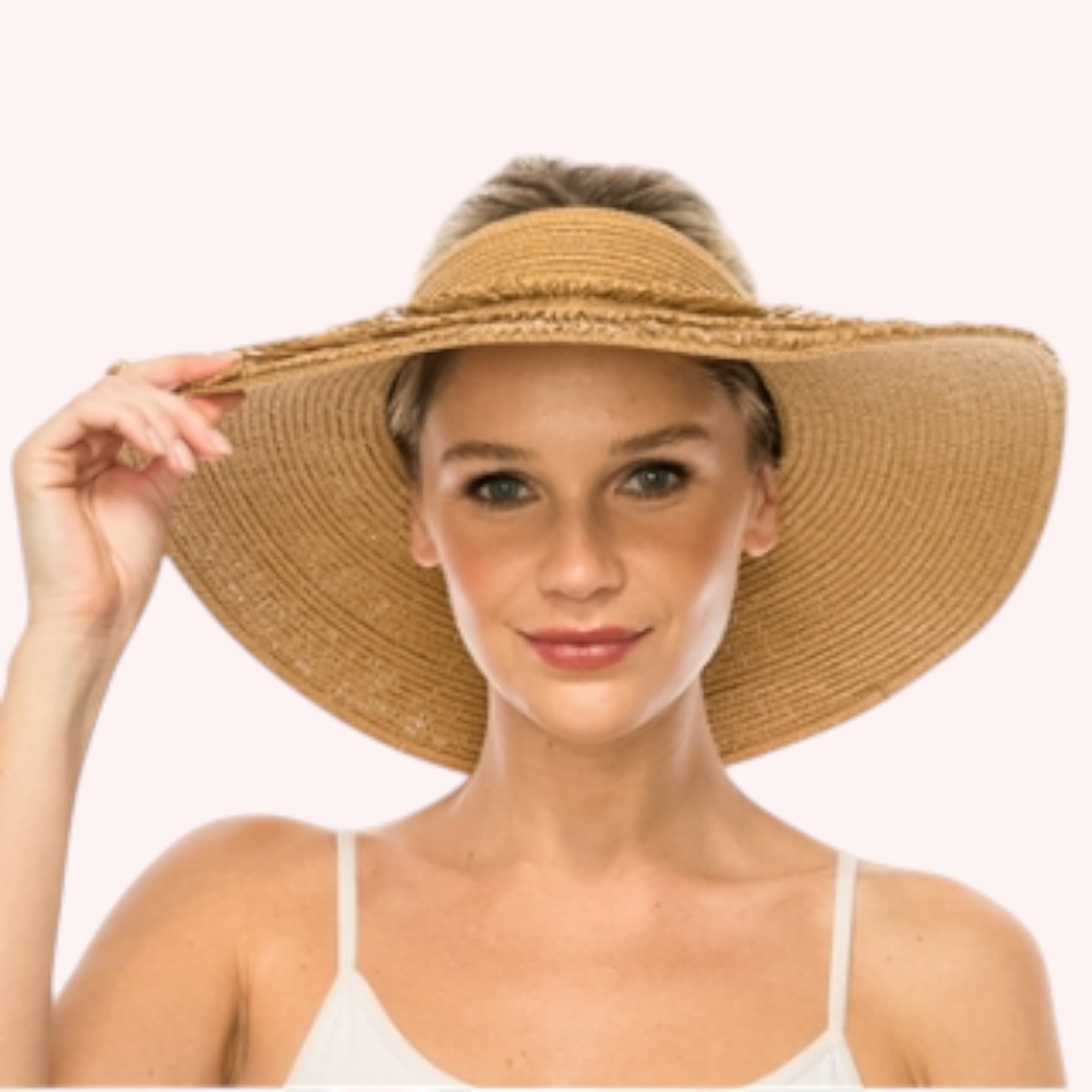 Straw lampshade sun hat with pinned-up back brim. Tropical print sheer sash tied through the eyelets. UPF 50+ Adjustable inner drawstring Brim: 4 in.