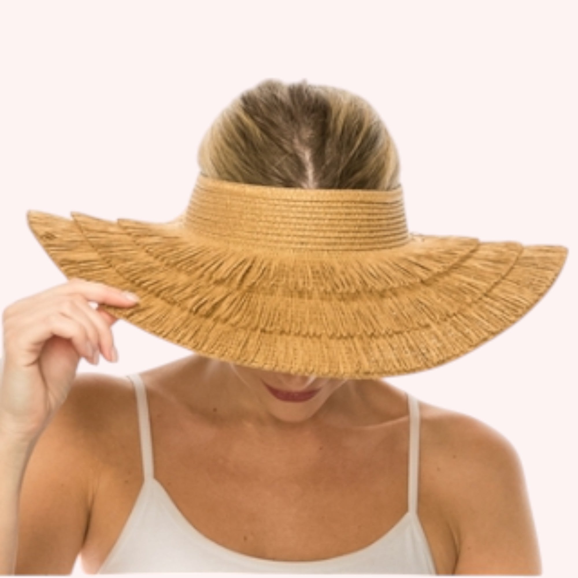 Straw lampshade sun hat with pinned-up back brim. Tropical print sheer sash tied through the eyelets. UPF 50+ Adjustable inner drawstring Brim: 4 in.