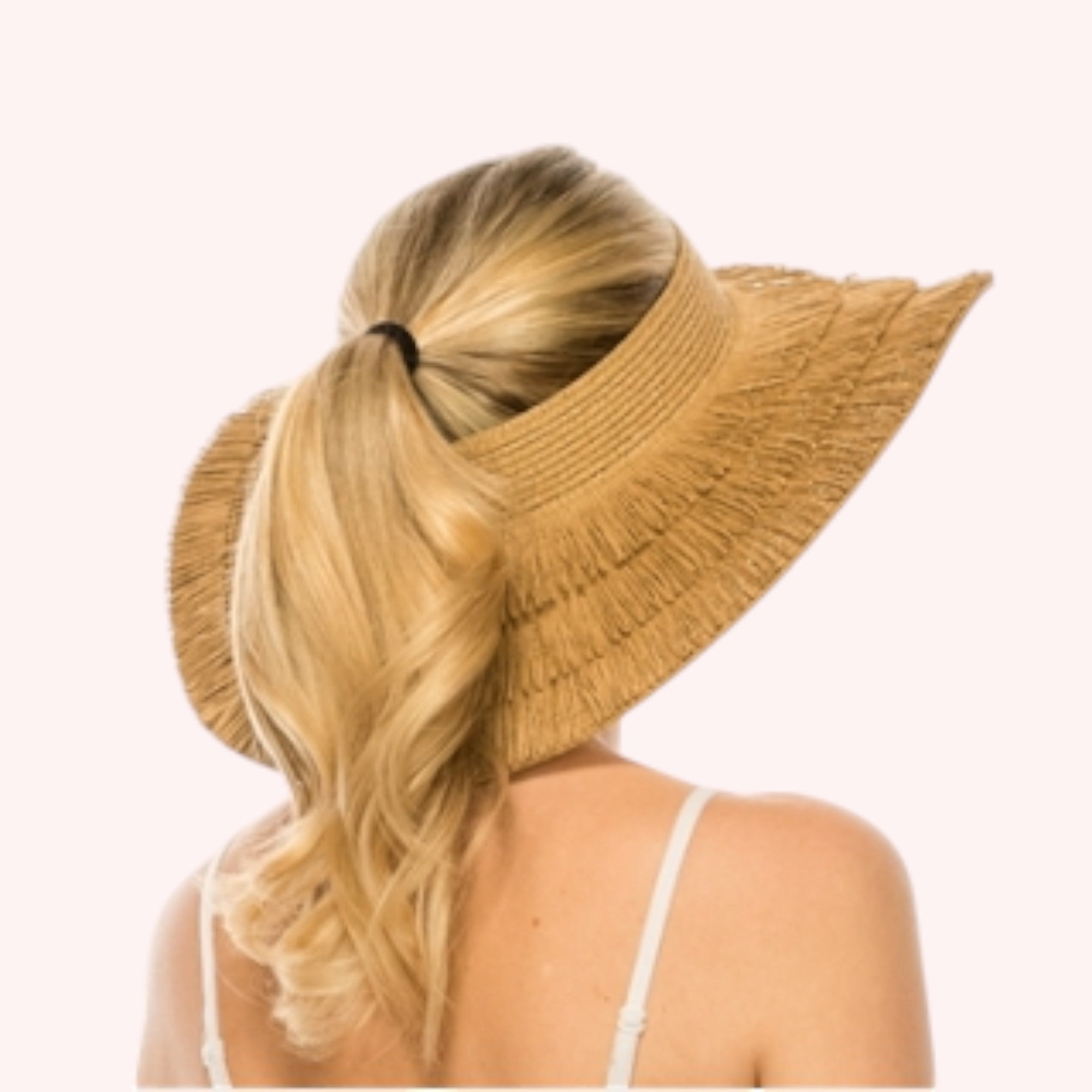 Straw lampshade sun hat with pinned-up back brim. Tropical print sheer sash tied through the eyelets. UPF 50+ Adjustable inner drawstring Brim: 4 in.