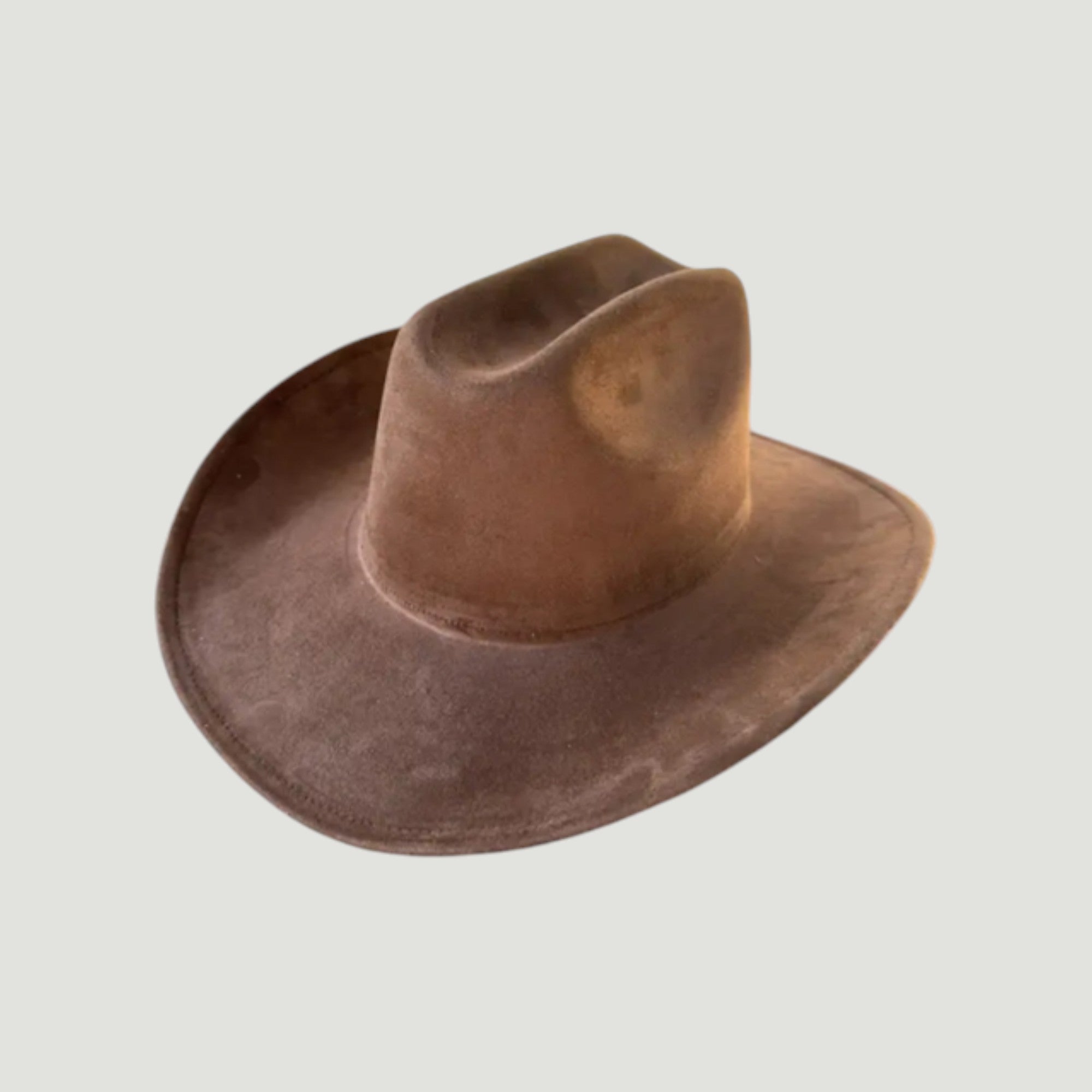 Structured vegan Suede cattleman cowboy hat with shapeable brim. Perfect for western, boho, and festival looks. Adjustable fit